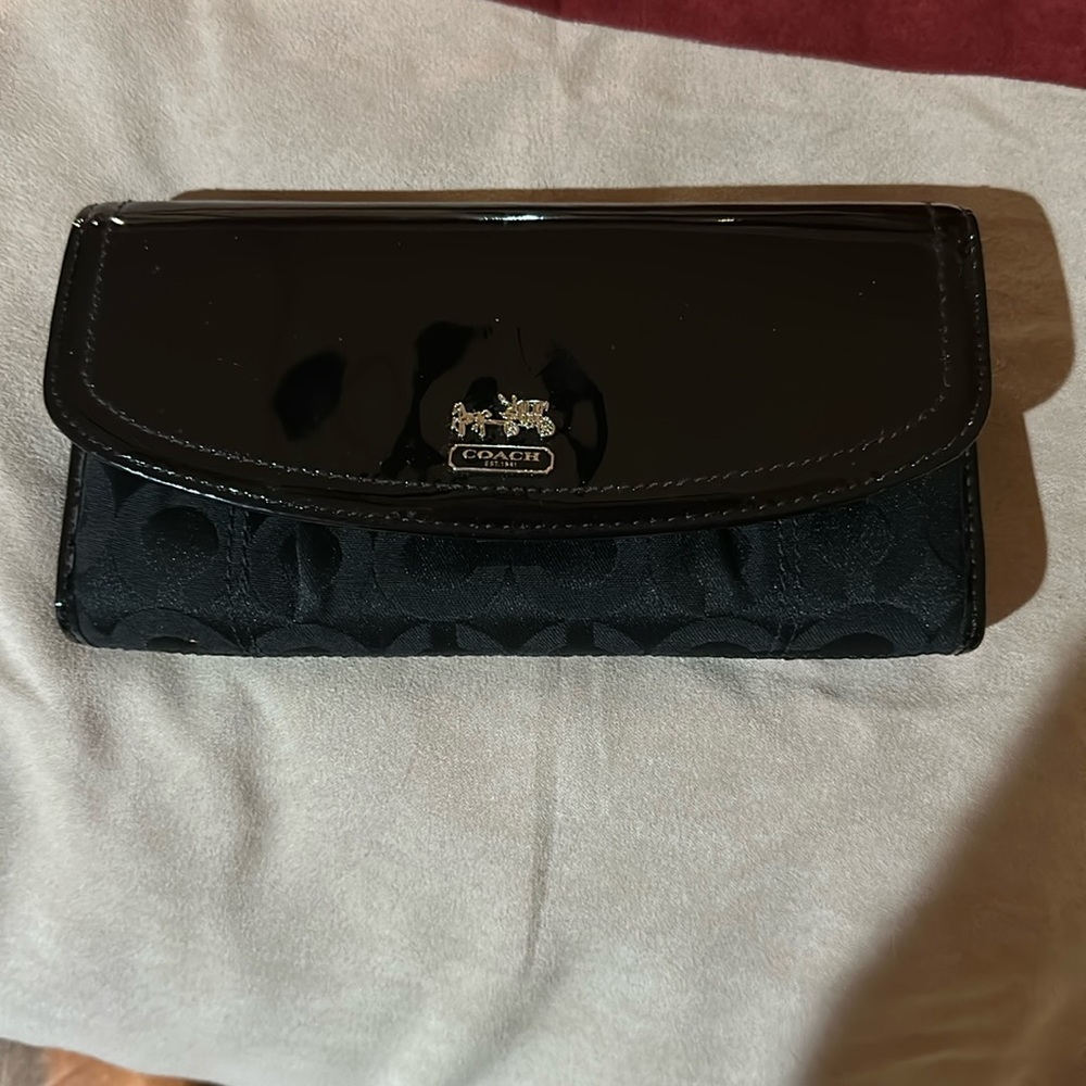 Coach wallet black printed seas on the front and backside